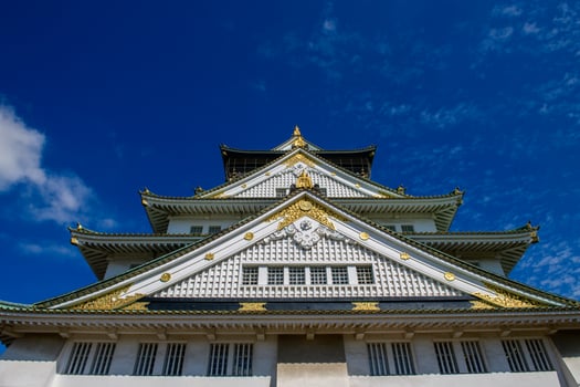 Osaka castle with blue sky background at Osaka city, Japan photo
