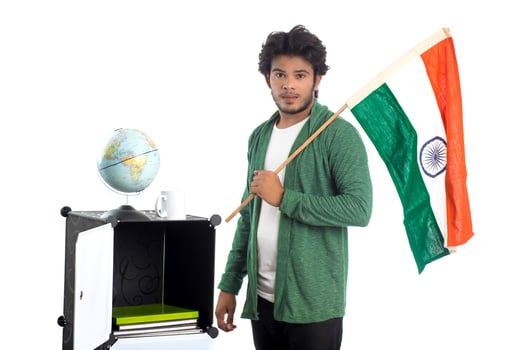 Young man with Indian flag or tricolor with world globe on white background, Indian Independence day, Indian Republic day photo