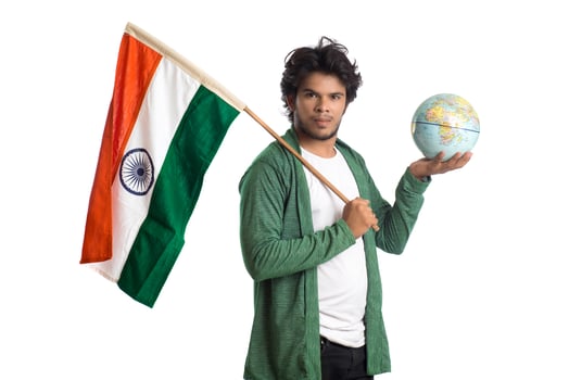 Young man with Indian flag or tricolor with world globe on white background, Indian Independence day, Indian Republic day photo