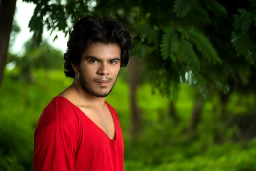 Handsome fashion young man posing outdoors photo