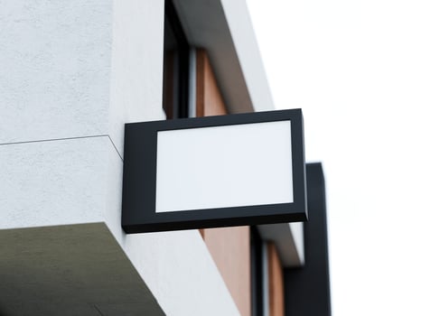 Blank logo sign board on a shop wall photo