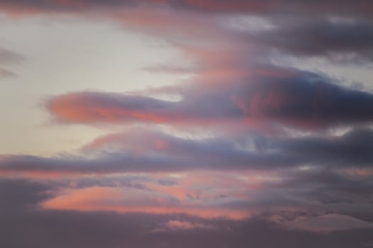 A beautiful sunset featuring a significant amount of clouds in the sky photo
