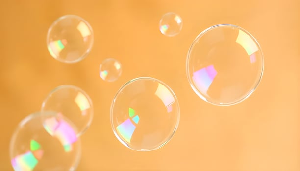 soap bubbles on a yellow background photo
