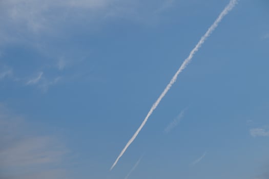 The trail left by a passenger plane in the sky. photo