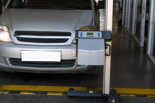 Checking the headlights of a vehicle in a car repair shop. photo
