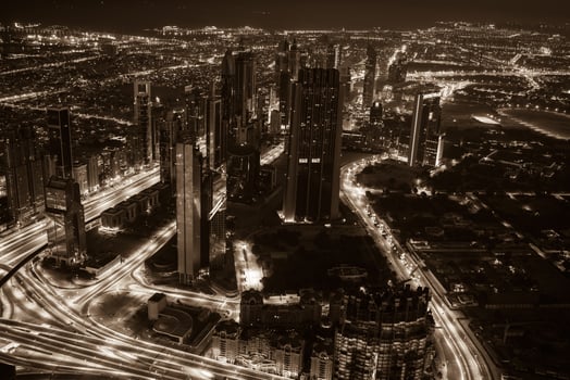 Dubai downtown night scene with city lights. Top view photo