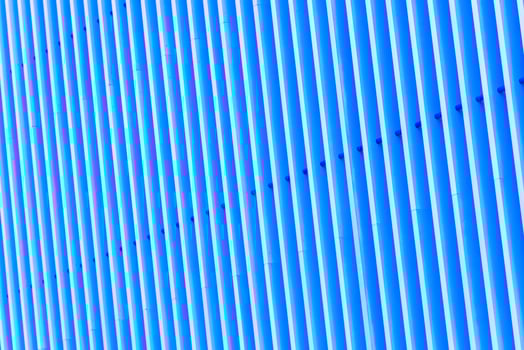 Detail of blue striped metal facade for background photo