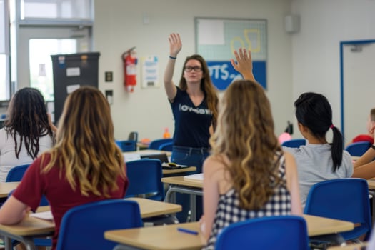 A Student Raises Her Hand to Answer a Question in a Classroom Setting photo