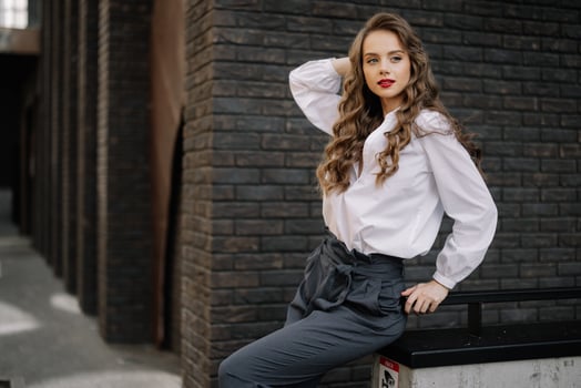 Businesswoman leaning on railing in urban setting photo