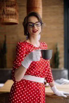 Elegant woman enjoying coffee in retro style photo