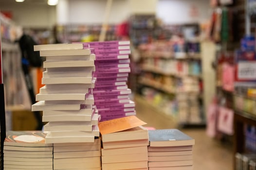 Close-up view of stacked books in a bookshop. photo