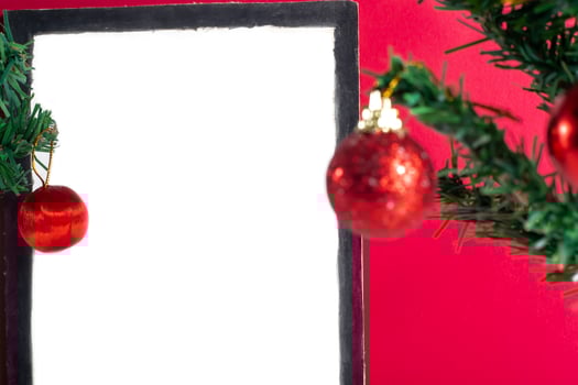 A blank white frame with christmas decorations on it photo