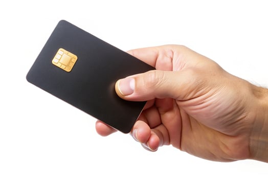 Blank black credit card isolated on white background, photo studio hand hold blank credit card