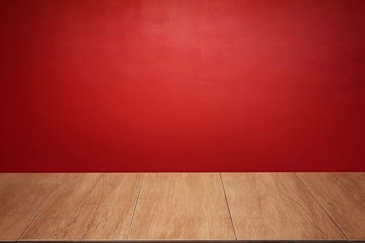 The wooden floor and walls of the room are colored red as the background. photo