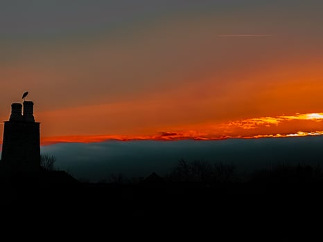 A sunset over a city photo