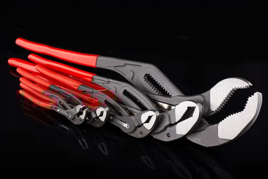 Set of Adjustable Wrenches with Red Handles photo