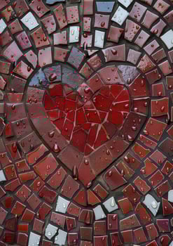 Broken heart mosaic with water droplets photo