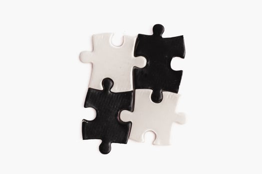 A puzzle piece with and black, sense of incompleteness and mystery photo
