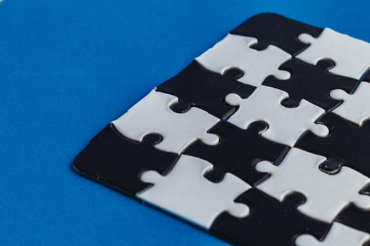 Black and white puzzle, teamwork challenge concept photo