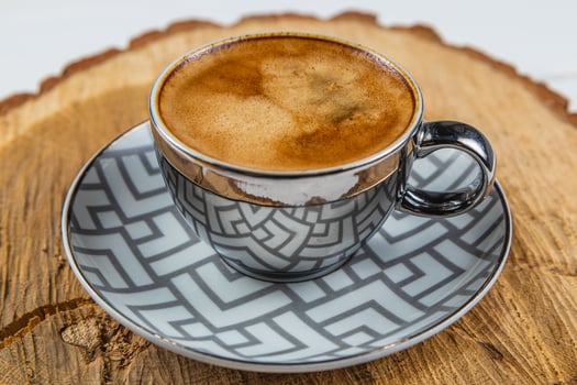 espresso cup on a wooden stand made of real oak photo