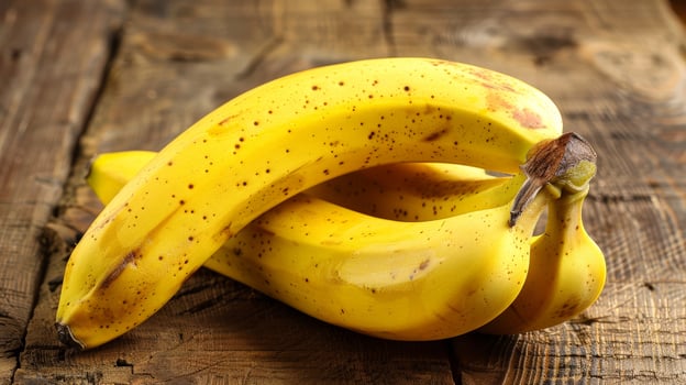 Ripe yellow bananas on wooden table photo