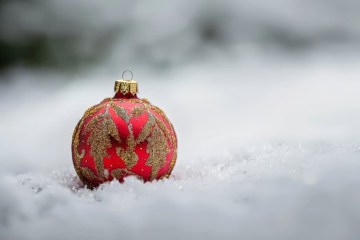 Festive christmas ornament in snow photo