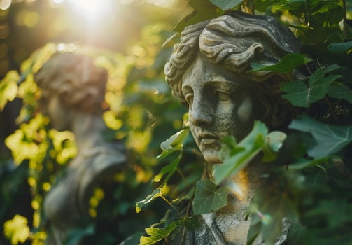 Serene garden statue surrounded by lush foliage photo