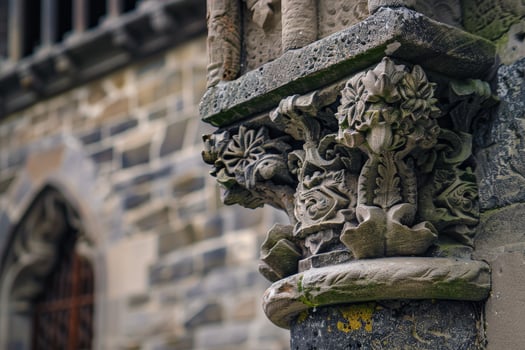 Ornate stone architectural detail with floral carvings photo