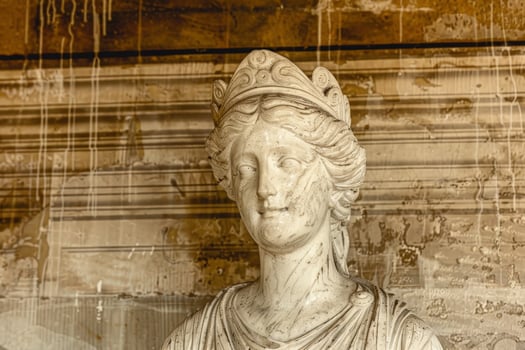 Ornate stone sculpture of a person with intricate details photo