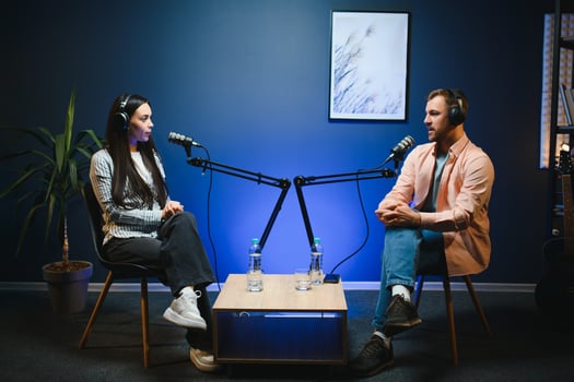 Show host interviewing woman during live stream, talking about fashion and style trends, disagreeing with her opinions. Man arguing with social media celebrity, recording podcast photo