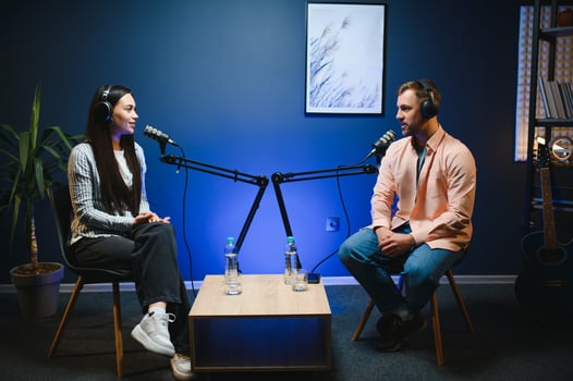 Show host interviewing woman during live stream, talking about fashion and style trends, disagreeing with her opinions. Man arguing with social media celebrity, recording podcast photo