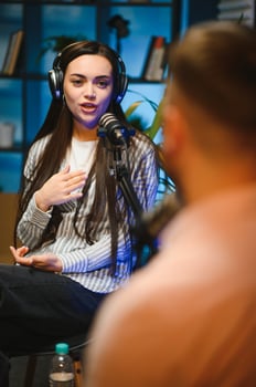 Show host interviewing woman during live stream, talking about fashion and style trends, disagreeing with her opinions. Man arguing with social media celebrity, recording podcast photo