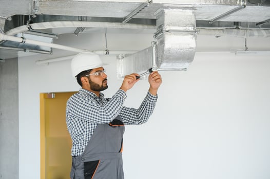 Ventilation cleaning. Specialist at work. Repair ventilation system HVAC. Industrial background photo