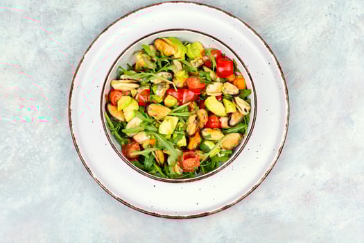 Plate with mussels salad. photo