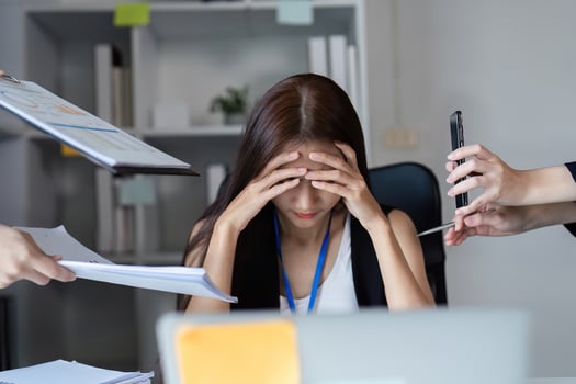 Focused Businesswoman Managing Work Documents in a Modern Office Setting photo