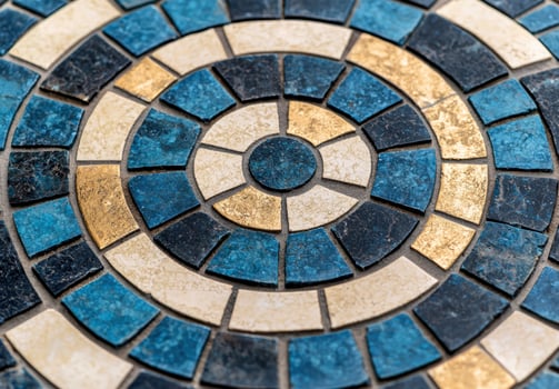 Intricate mosaic tile pattern in blue and gold tones photo