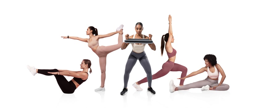 A group of five women participates in different workout routines, showcasing strength and flexibility in a bright and minimalistic indoor space. photo