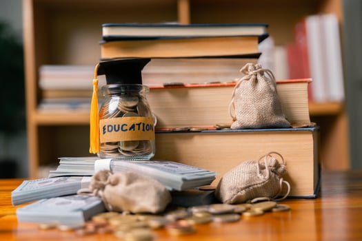 Planning for education abroad involves saving money and making wise investments in finance, which can lead to graduation success, future wealth, cognitive growth, and well-managed budget. hat, idea photo