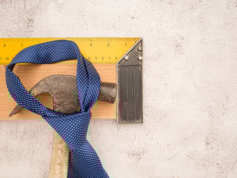 Happy Father's Day. Top view of construction handy tools and necktie over a cement floor photo