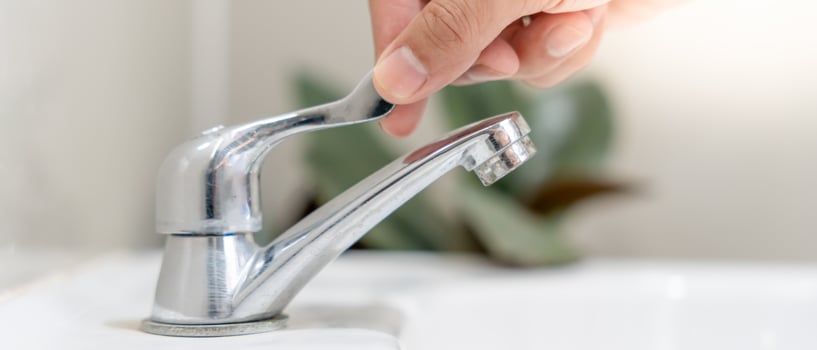 Save water. Volunteer keeps turning off the running water in the bathroom to protect environment. Greening planet, reduce global warming, Save world, life, future, risk energy, crisis , water day. photo