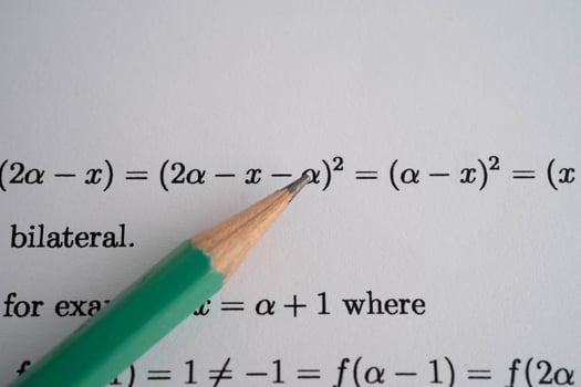 Pencil on mathematic formula exercise test paper in education school. photo