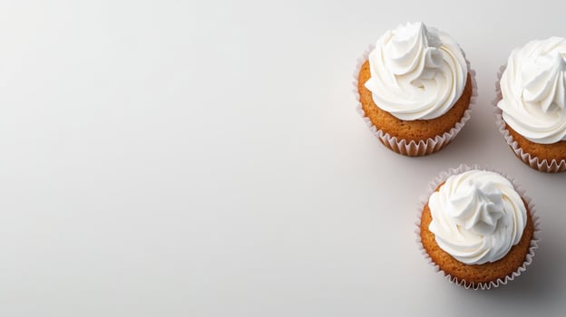 Delicious cupcakes with creamy frosting on a light background photo
