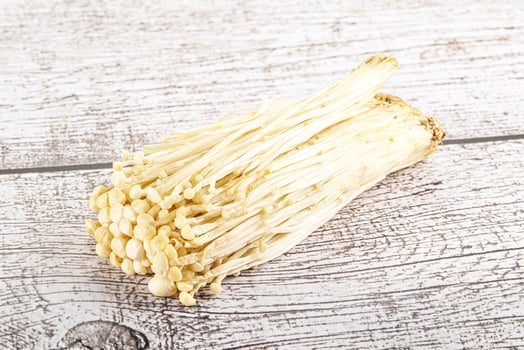 Tasty raw enoki mushroom heap photo