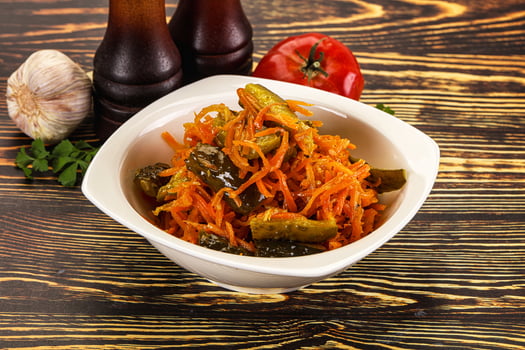 Salad with korean carrot and cucumber photo