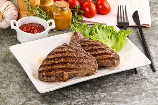 Delicus grilled beef steak with sauce photo
