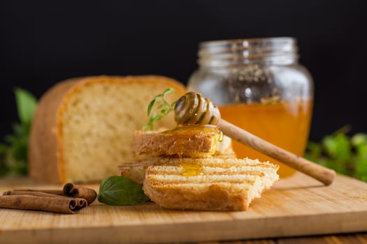 bread fried sweet toasts with honey on wooden board with cinnamon photo