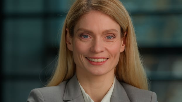 Beautiful smiling toothy dental smile happy female face Caucasian mature middle-aged adult woman looking at camera posing alone in office millennial businesswoman professional close up front portrait photo