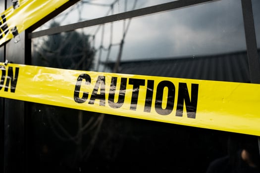 Caution yellow tape. Do not enter. Yellow caution tape on the home at daytime. photo