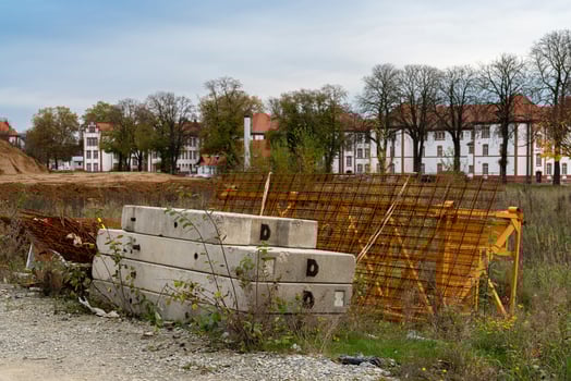 Construction site with materials and abandoned buildings in autumn photo