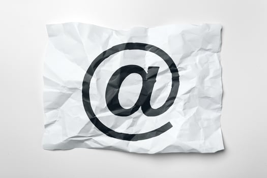E-mail symbol on crumpled paper photo